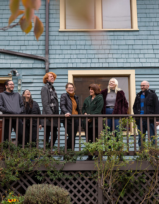 madeline hartman standing on Psychic Awakenings porch with students